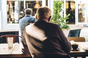 Man sitting alone at a restaurant.