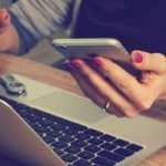 Woman checking an email on her phone.