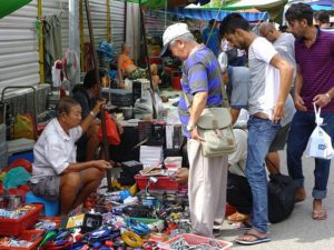 Men haggle over the price of swap meet goods like marketers looking for a big social media roi.